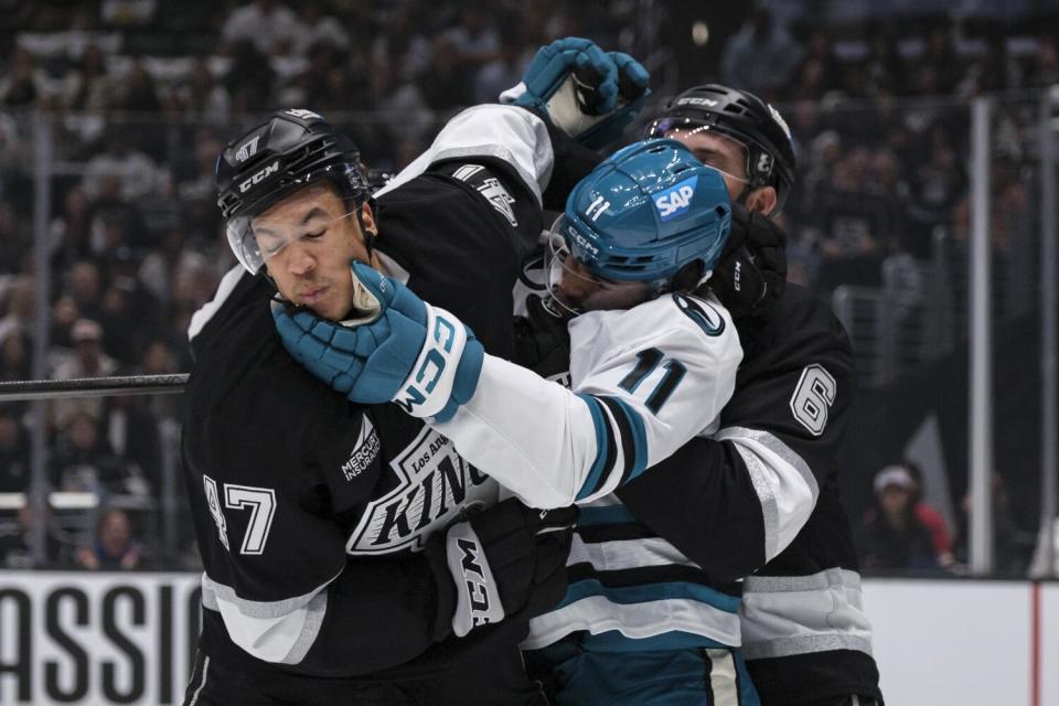 San Jose Sharks center Luke Kunin gets in a fight with Kings left wing Andre Lee during the first period Thursday.