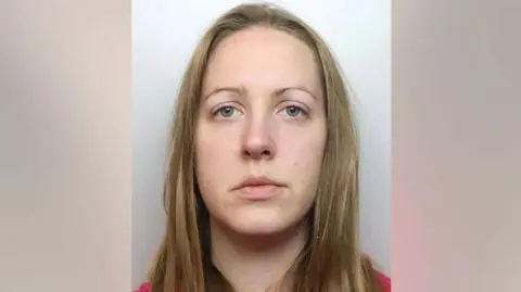 Cheshire Constabulary A police mugshot of Lucy Letby, who has straight blonde hair and looks into the camera with a blank expression. 