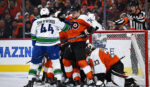 Flyers flat in dwelling opener, shut out by Canucks