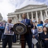 Sen. Cory Booker, D-NJ., accompanied by Senate Majority Leader Chuck Schumer, D-NY, left, and Sen. Tammy Duckworth, D-Ill., right, speaks about the need to protect rights to in vitro fertilization (IVF), before Senate vote on the issue.