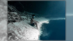 Actual Pic of Man Sitting on Fringe of ‘Underwater Cliff’?