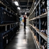 An election office worker moves bags of election supplies at the Robert L. Gilder Elections Service Center in Tampa, Florida, on November 2, 2024.