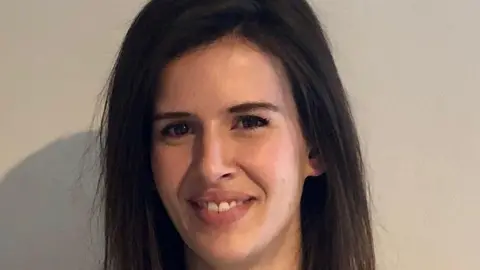 Natash Kurzeja Close-up of Natasha Kurzeja smiling, with long dark brown hair