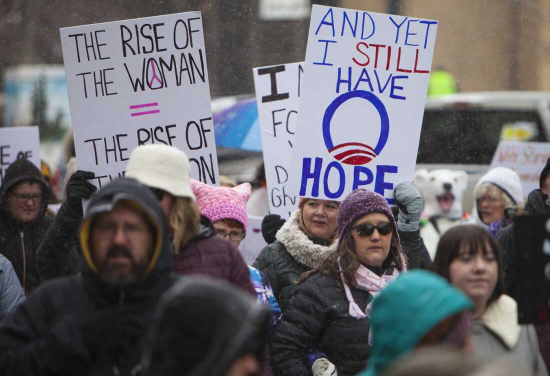 Protesters wave signs and chant during a Women's March, Jan. 20, 2018, in Casper, Wyo.