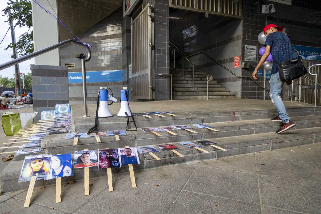 Photographs of individuals who died from overdoses are displayed outside Huntington Station in the Kensington neighborhood of Philadelphia during International Overdose Awareness Day on Aug. 29, 2024.