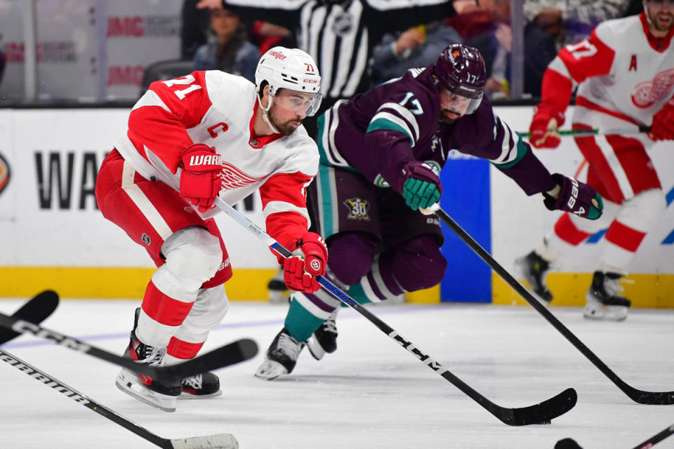 Jan 7, 2024; Anaheim, California, USA; Detroit Red Wings center Dylan Larkin (71) moves the puck ahead of Anaheim Ducks left wing Alex Killorn (17) during the third period at Honda Center