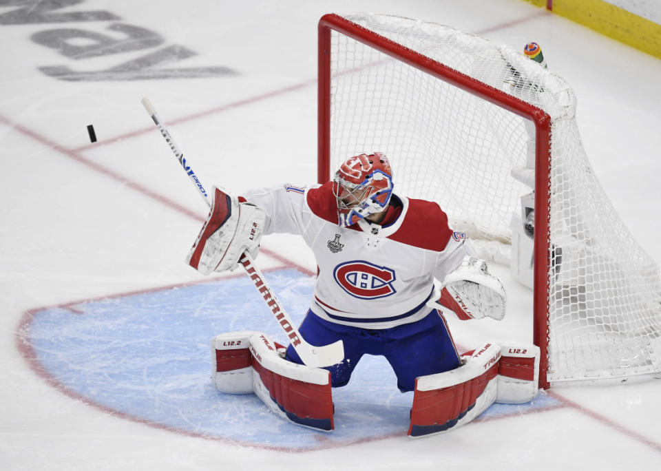 Jun 30, 2021; Tampa, Florida, USA; Montreal Canadiens goaltender Carey Price (31) makes a save against the Tampa Bay Lightning during the third period in game two of the 2021 Stanley Cup Final at Amalie Arena. Mandatory Credit: Douglas DeFelice-Imagn Images