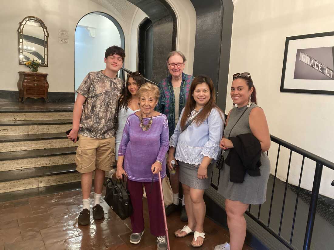 Andrea Levitt, center, says connecting with Angelo Williams (far left) has helped her out of a depression in recent months. Here, she stands in her apartment lobby with (from left) Angelo's girlfriend, Emme Aviles, Dorot mentor Dan Joiner, Angelo's mom, Mae Tedoco-Williams, and Emme's mom, Melanie Aviles.